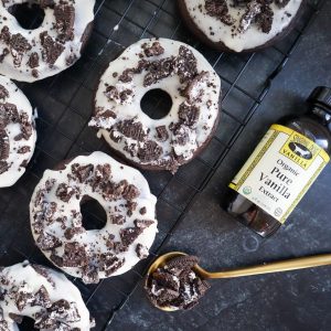 Gluten-Free Oreo donuts on a baking rack with Singing Dog Vanilla